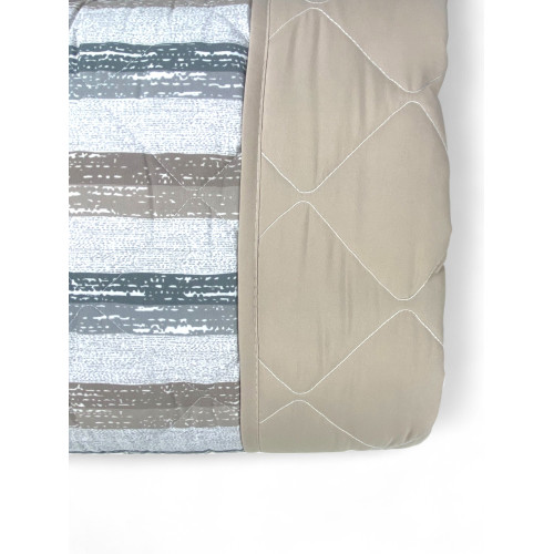 Lightweight quilt with solid beige border and diamond quilting