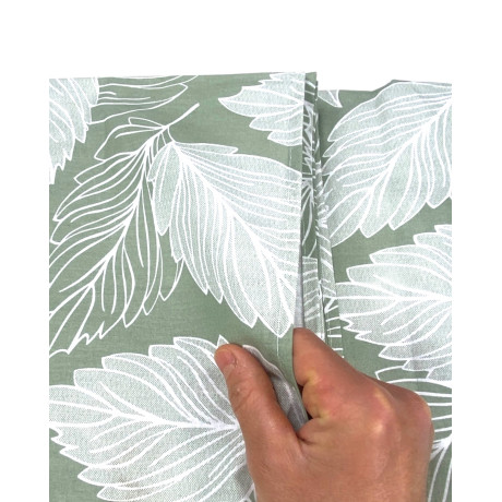 Green fabric detail with white leaf pattern
