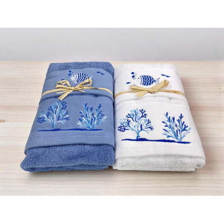 Fish and coral embroidery detail on white terry towel